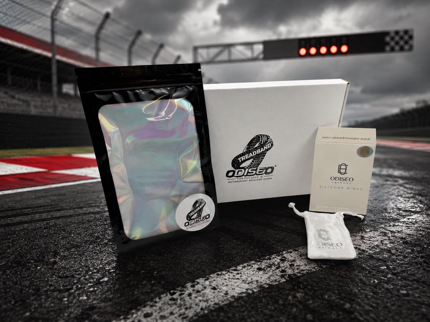 Odiseo Encircle ring packaging displayed at a wet racing circuit